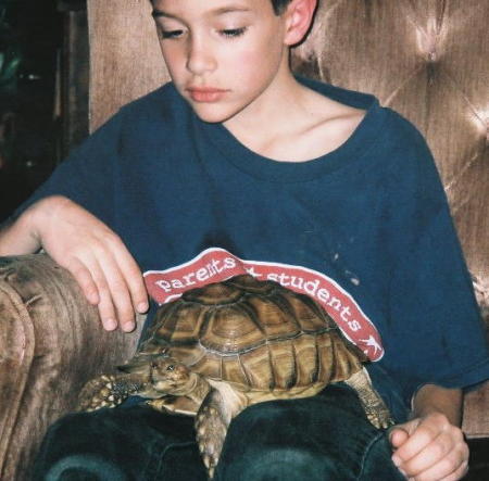 My youngest with his turtle, Little Foot. March 2007