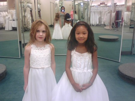 shaina and annabelle trying on flower girl dresses