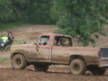 Myhusband  playing in the mud