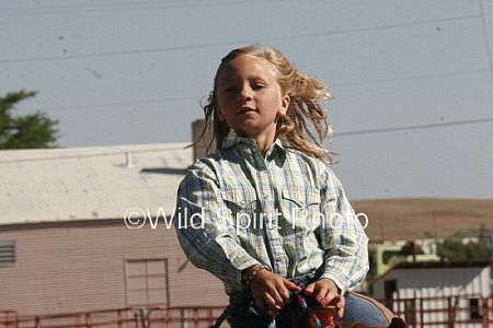 Sydnee on her horse in the rodeo