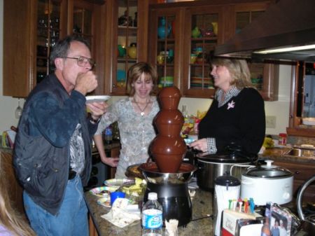 Terry and the chocolate fountain, with Judy and Lisa