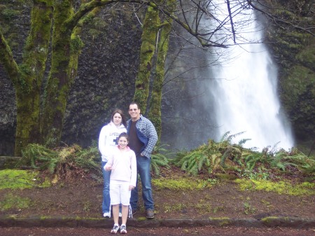 Sami, Joe, and Morgan in front of a waterfall in Portland