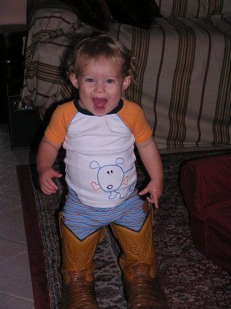 Horsing around in Daddy's boots!