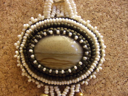 Beaded cabochon.