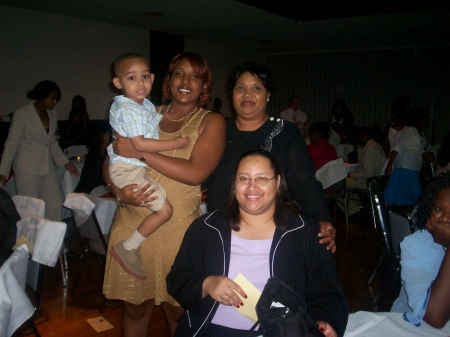 My daughters and I with my nephew at a wedding