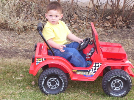 My little man in his big red Jeep!!
