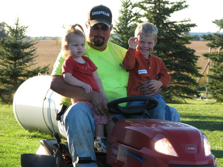 The kids and i mowing the lawn