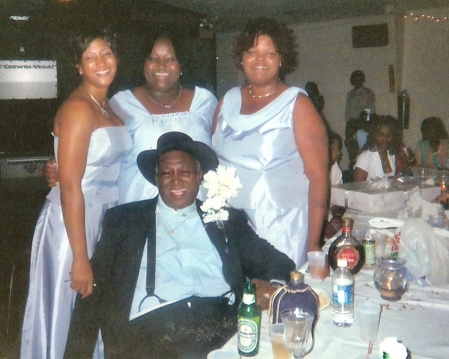 my dad and little sisters at brother wedding