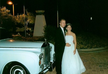 My hubby and I standing in front of the limo