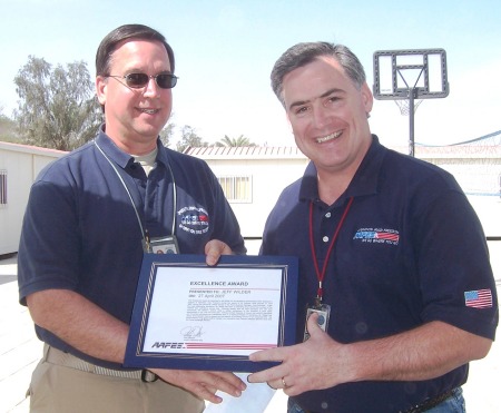 My husband, Jeff (right) recieving an award in Iraq, he's a civillian-not military