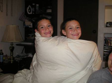 My Twins wrapping up in my blanket!