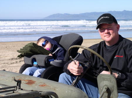 Me and my son at the beach in my old jeep.