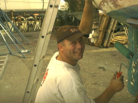 Josh painting our boat!