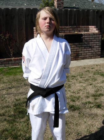 Jonathan with his Black Belt