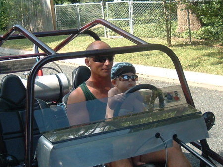 Little Man driving Pops dune buggy