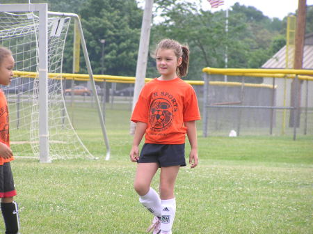 Maddie playing soccer