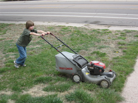 Joey mowing the grass.