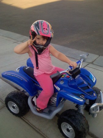 My daughter on her little quad