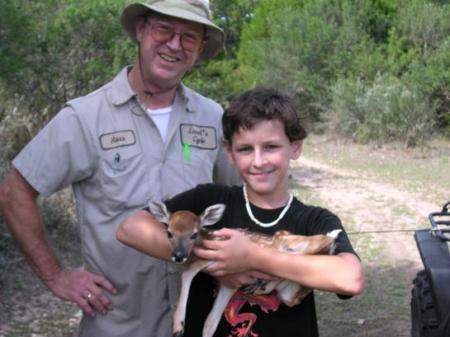 My dad and son with a fawn