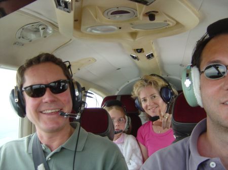 With my wife and daughter on a plane ride in UK