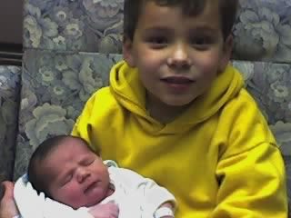 My son holding his newest cousin
