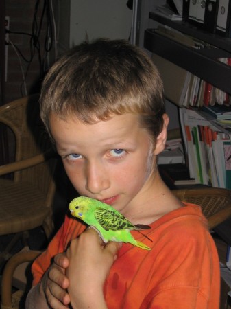 Leo (the youngest of the family) showing his parrot