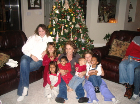 Chads daughter Cassie, Step daughter Whitney, Grandaughter Kendall, 4 foster children Cody,Bella,Aubrey,& Alana whom they have adopted and pictured with sheldons daughter Eliza  Oh thats me in the center busy Gramma