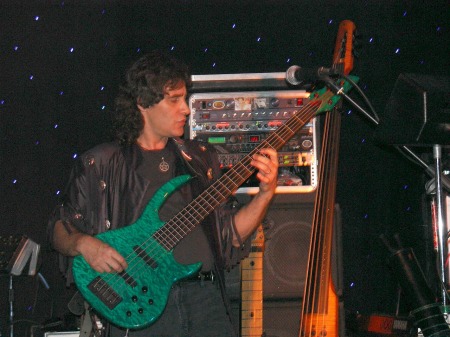 My hubby playin' one of his 4,852 basses - ha ha ha!