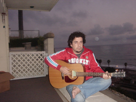 My Son Austin playing guitar on my back patio. He is graduating ffrom USC May 11 2007. Thank goodness!