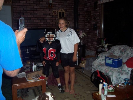 Kyle & Katie in football & soccer uniforms