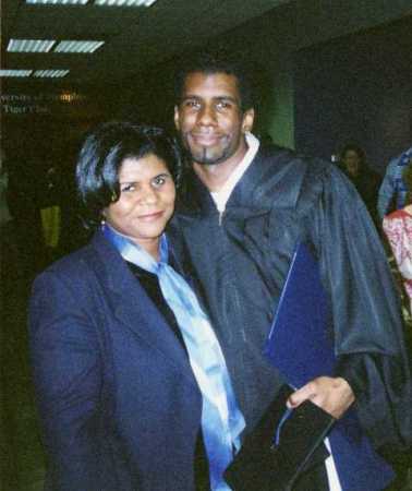 My mom Gwendolyn and I at my graduation at the U of M