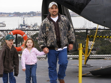 Robert and the kids on USS Midway