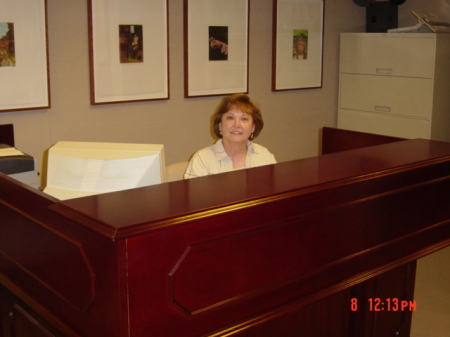 Barbara Hendry  at her desk.