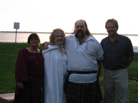 Chris and I with the bride and groom