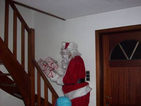 SANTA MAKING HIS WAY UP STAIRS