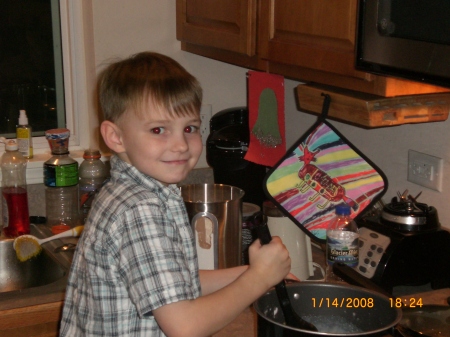 Jack helping Dad cook