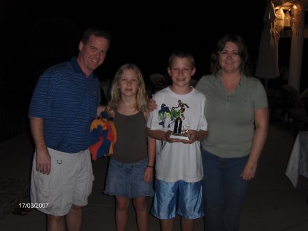 My son, Scott holding his basketball championship trophy