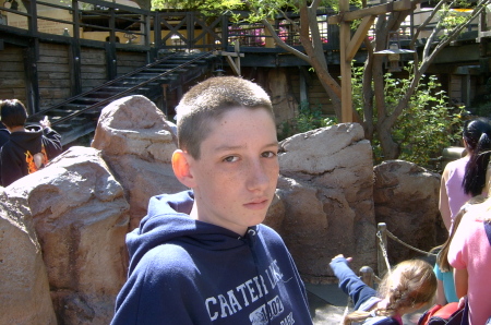 James-waiting in line for a ride at Disneyland (April 2007)