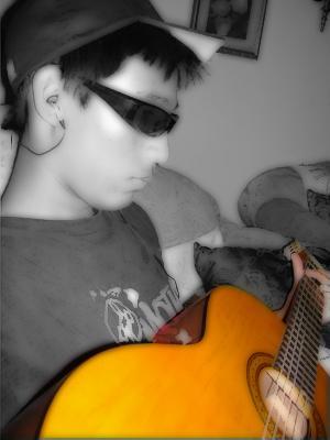 Elika (my stepson) playing his guitar