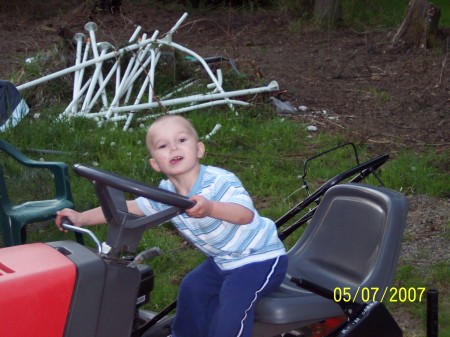 Brian on Pappa's tractor as he calls it, during our last months visit home.