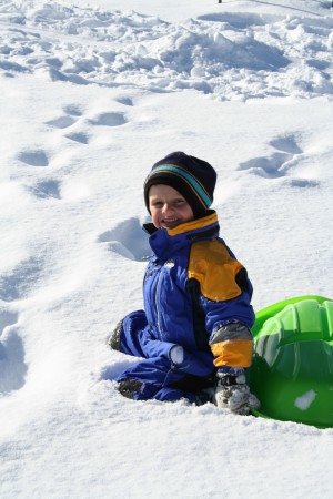 Chris in the Backyard Sledding