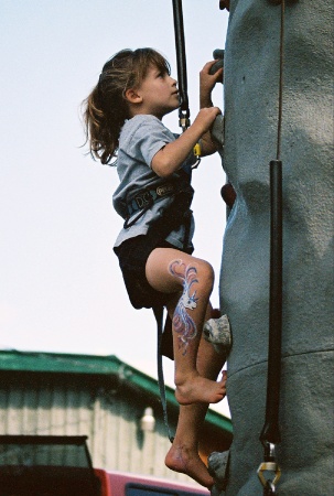 Emily climbing rock wall