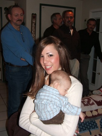 aunt loves her nephew with her uncles and father in the background