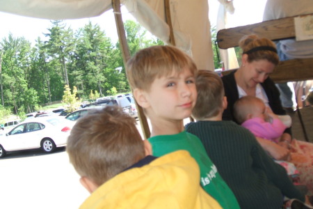 Boys going for a horse drawn buggy ride.