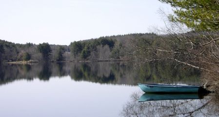 Rowboat on still water.