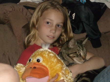 Emily playing with our cat, Kazi