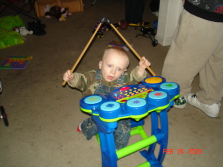 Lil Sam playing his drums