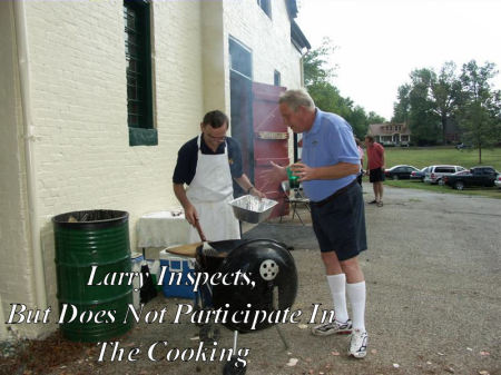 Larry inspects Mark's cooking