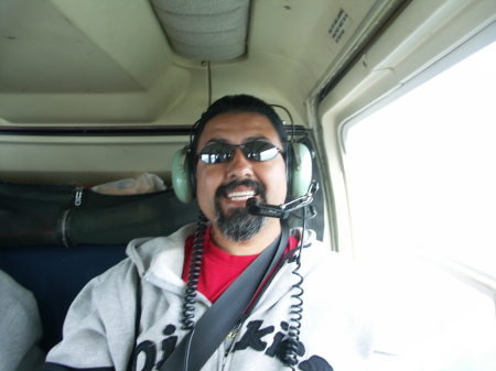 That's me on a helicopter in Alaska. What fun!