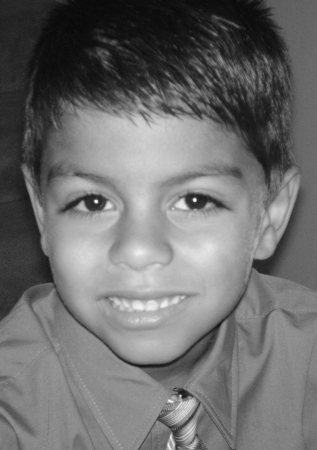 My son Angel....Handsome huh?...hes only 7!! sorry